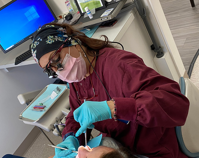 Roberta performing a dental treatment - at Ridgewood Dentistry, NJ