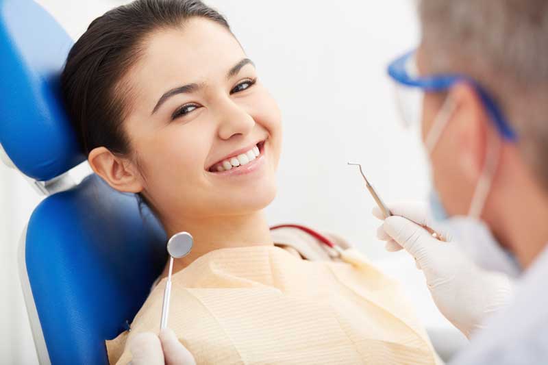 Happy Patient in Dental with Doctor